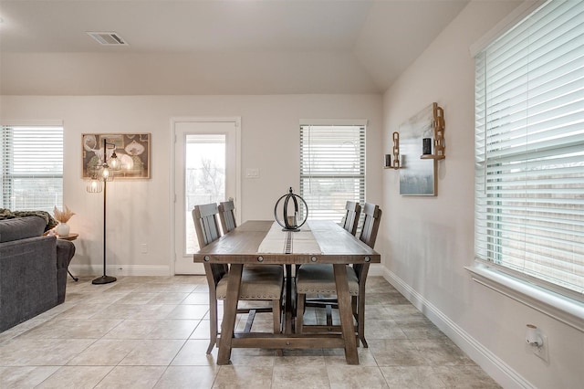 dining room with visible vents, baseboards, and light tile patterned floors