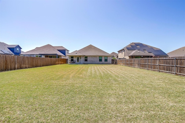 view of yard featuring a fenced backyard
