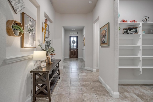 foyer entrance with baseboards