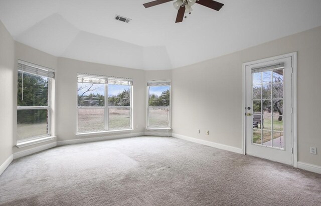 empty room with baseboards, visible vents, and carpet flooring