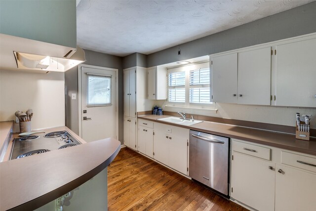 kitchen featuring a sink, a healthy amount of sunlight, white cabinets, stainless steel dishwasher, and dark wood-style floors