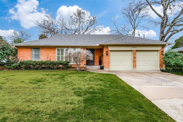 ranch-style home with concrete driveway, brick siding, an attached garage, and a front lawn