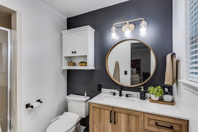 bathroom featuring toilet, an enclosed shower, connected bathroom, and vanity