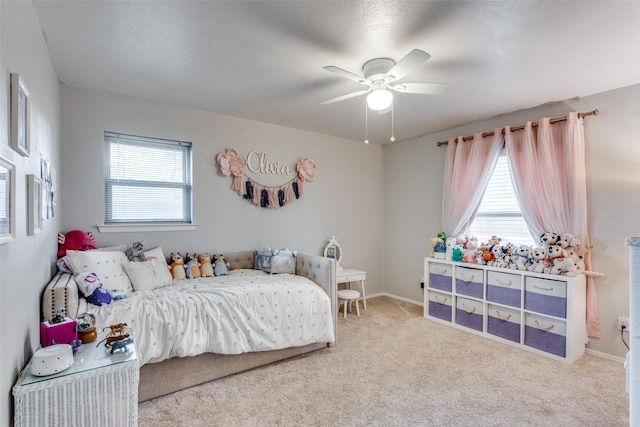 bedroom with carpet floors, baseboards, and a ceiling fan