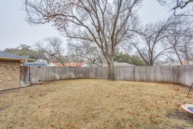 view of yard with a fenced backyard