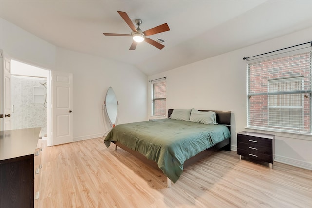 bedroom featuring lofted ceiling, visible vents, light wood-style flooring, and baseboards