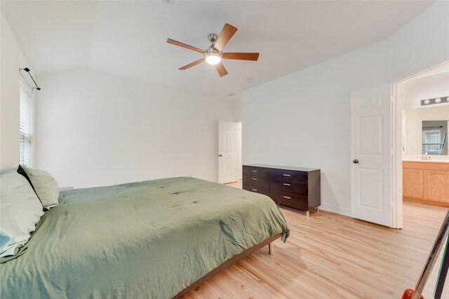 bedroom with vaulted ceiling, light wood-type flooring, and a ceiling fan