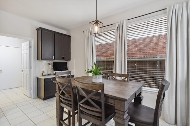 dining area featuring light tile patterned floors