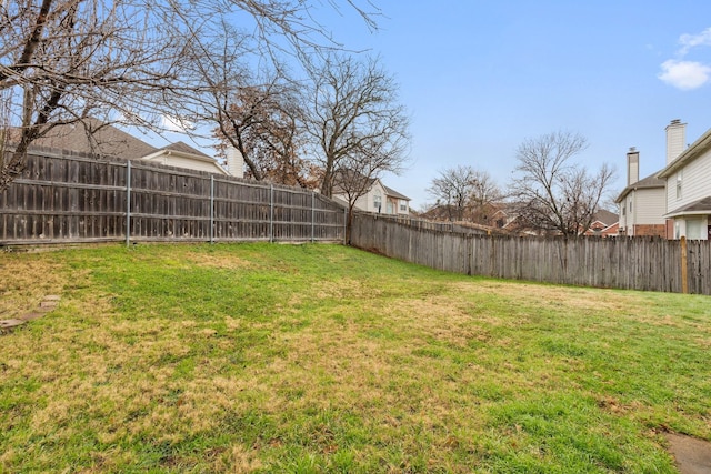 view of yard with a fenced backyard