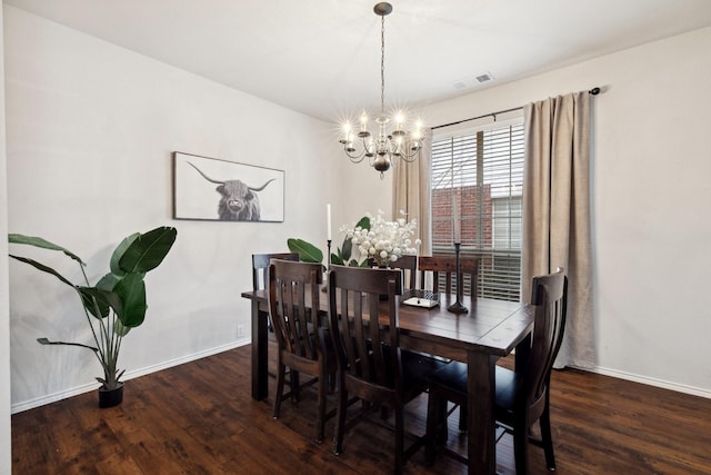 dining room with dark wood-style floors, a chandelier, visible vents, and baseboards