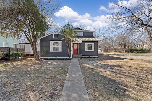 bungalow-style home featuring metal roof