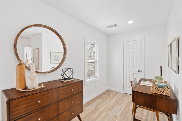 office area featuring light wood-type flooring, visible vents, baseboards, and recessed lighting