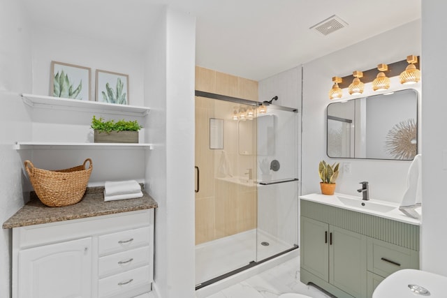 bathroom with marble finish floor, a shower stall, visible vents, and vanity