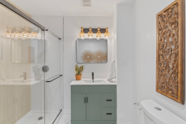 full bath featuring visible vents, toilet, vanity, and a shower stall