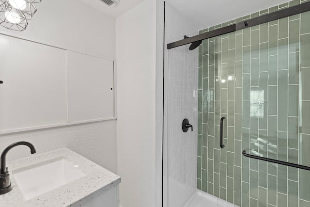 full bathroom with a shower stall and a sink