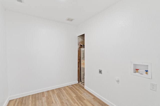 laundry room featuring hookup for an electric dryer, washer hookup, baseboards, water heater, and light wood finished floors