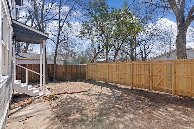 view of yard featuring a patio area and a fenced backyard