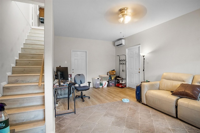 home office with ceiling fan, wood finished floors, and a wall mounted air conditioner