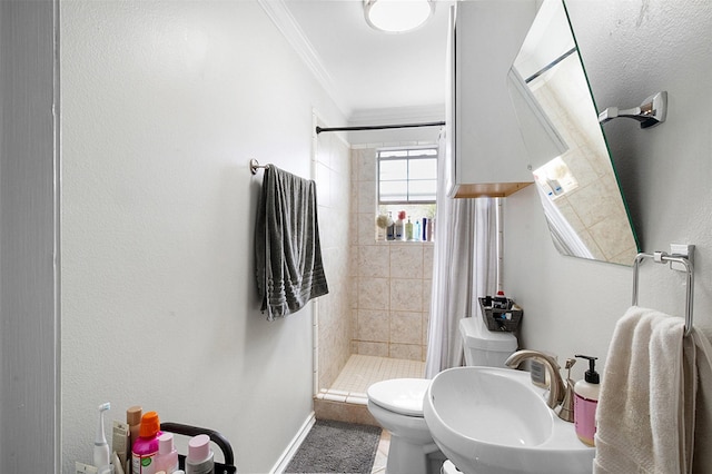 full bathroom featuring ornamental molding, a sink, a shower stall, and toilet