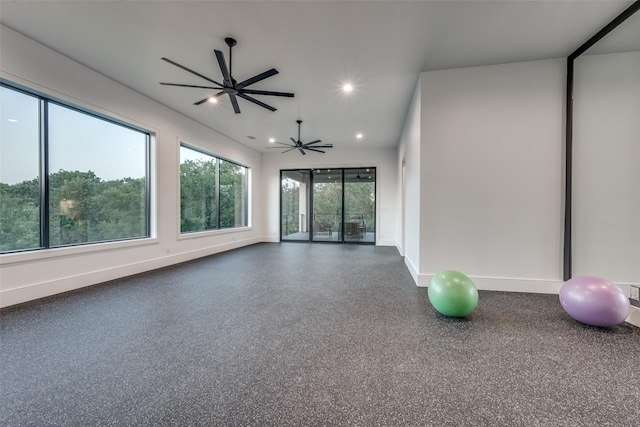 spare room featuring a ceiling fan, recessed lighting, baseboards, and speckled floor