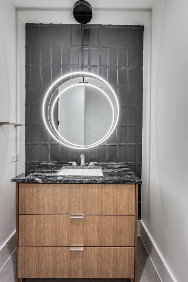 bathroom featuring vanity and baseboards