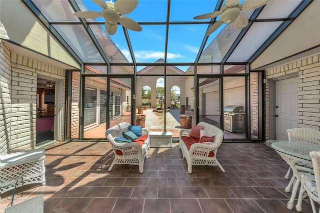 sunroom / solarium with vaulted ceiling and ceiling fan