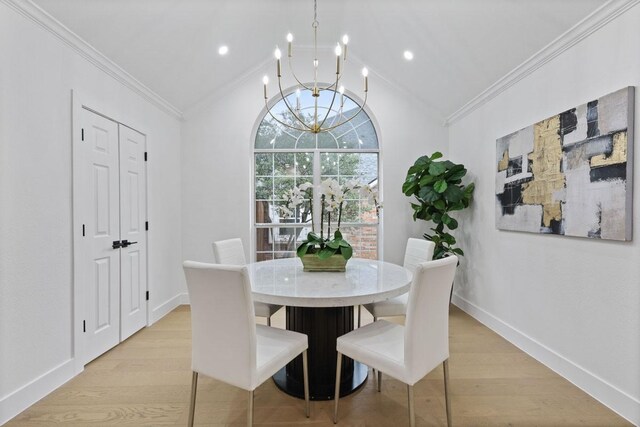 dining area with light wood-type flooring, baseboards, crown molding, and lofted ceiling