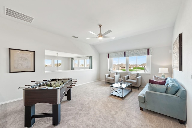 game room with light colored carpet, visible vents, vaulted ceiling, and baseboards