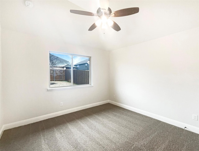 unfurnished room featuring carpet floors, a ceiling fan, and baseboards