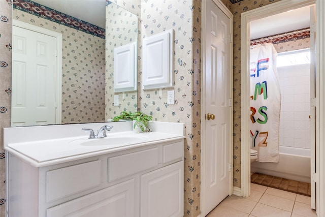 bathroom with wallpapered walls, shower / bath combo, toilet, tile patterned flooring, and vanity