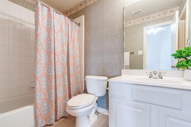 bathroom featuring tile patterned flooring, visible vents, toilet, and wallpapered walls