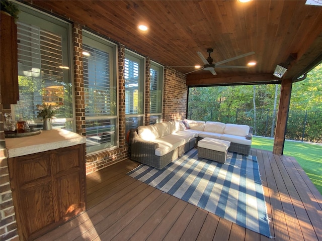 deck featuring an outdoor living space and a ceiling fan