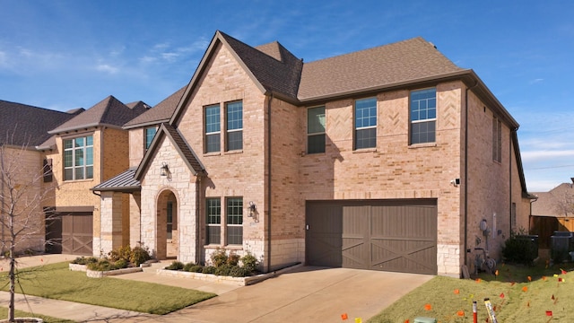 view of front of home with brick siding, a shingled roof, a garage, stone siding, and driveway