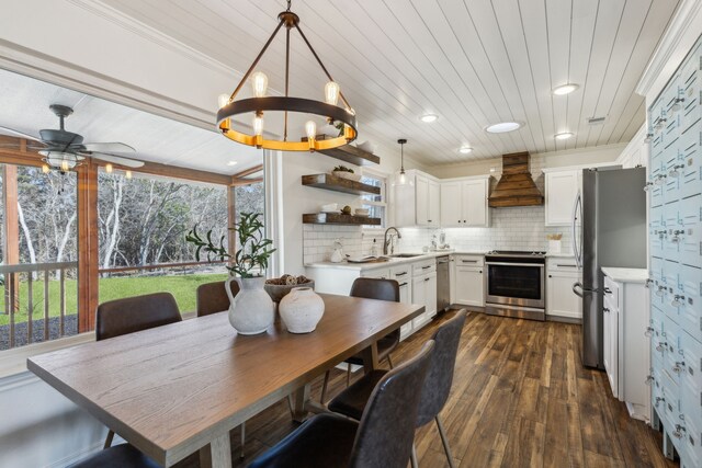 dining space featuring wooden ceiling, ceiling fan, ornamental molding, and dark wood-style flooring