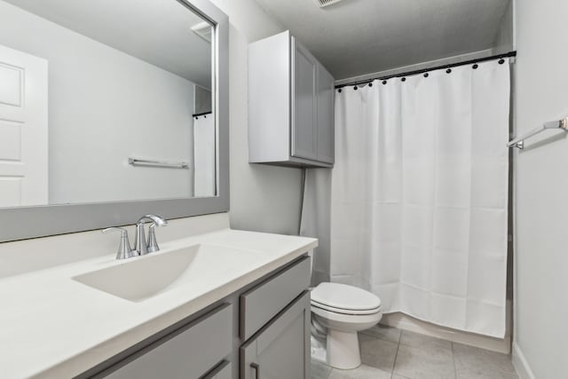 2417 Robin Way, Northlake, TX 76247 - full bath with tile patterned floors, toilet, vanity, and curtained shower