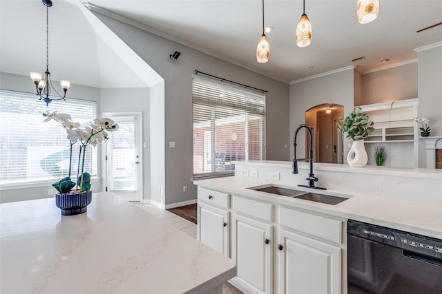 kitchen featuring a sink, white cabinets, dishwasher, and hanging light fixtures