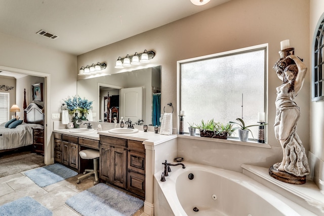 full bathroom featuring a sink, double vanity, ensuite bath, and visible vents