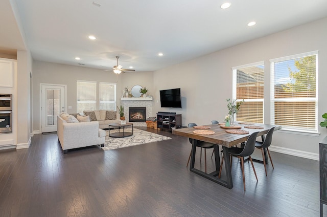 living room with dark wood-style floors, baseboards, a ceiling fan, and recessed lighting