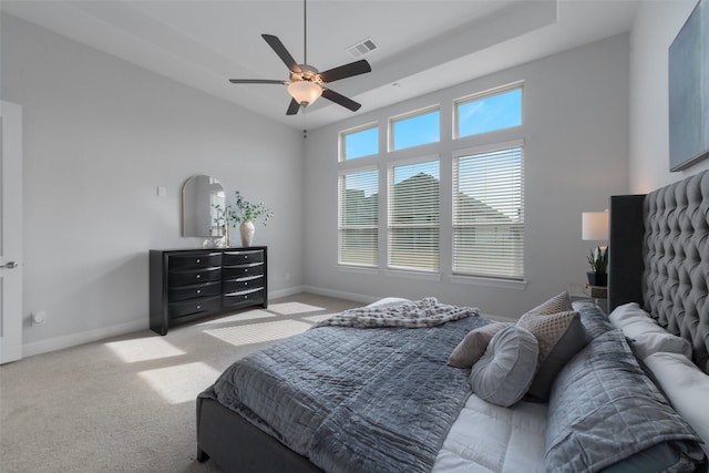 bedroom with ceiling fan, carpet floors, visible vents, and baseboards