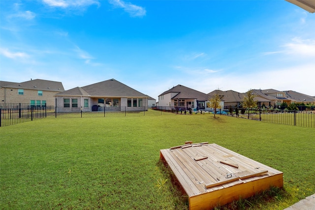 view of yard featuring fence and a residential view