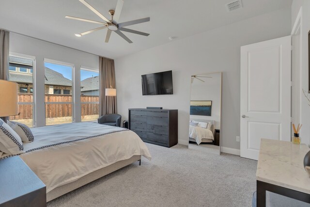 bedroom with baseboards, visible vents, ceiling fan, and light colored carpet