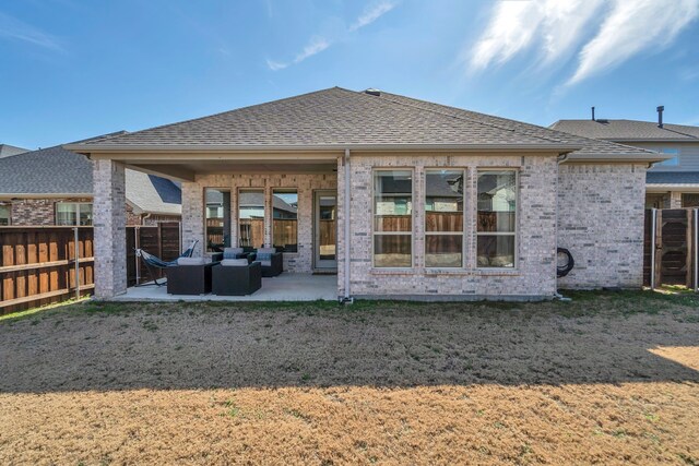 back of house featuring a patio area, fence, brick siding, and roof with shingles