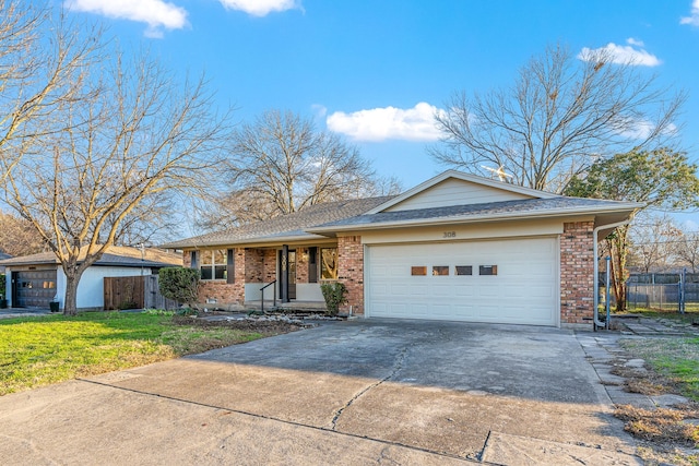 single story home with a garage, brick siding, fence, driveway, and a front yard