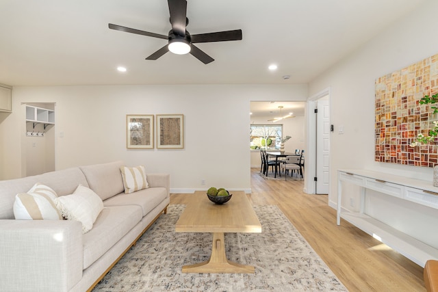 ranch-style home featuring a garage, brick siding, fence, driveway, and a front lawn