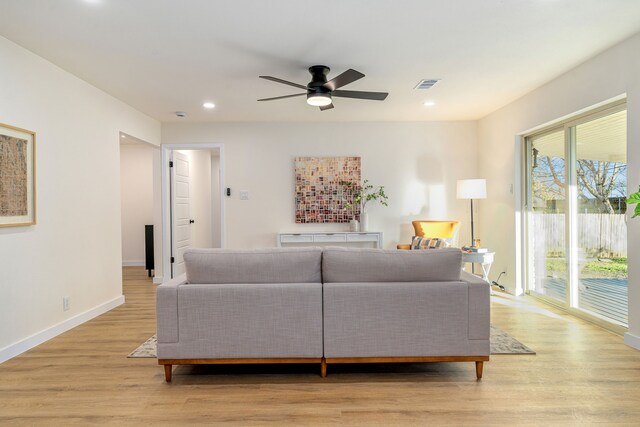 dining room with visible vents, light wood-style flooring, and baseboards