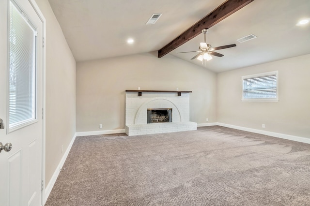 unfurnished living room featuring lofted ceiling with beams, carpet, visible vents, and a brick fireplace