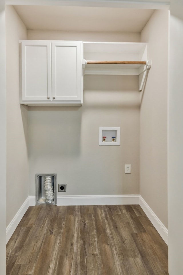 laundry area with cabinet space, baseboards, dark wood-style flooring, hookup for an electric dryer, and washer hookup