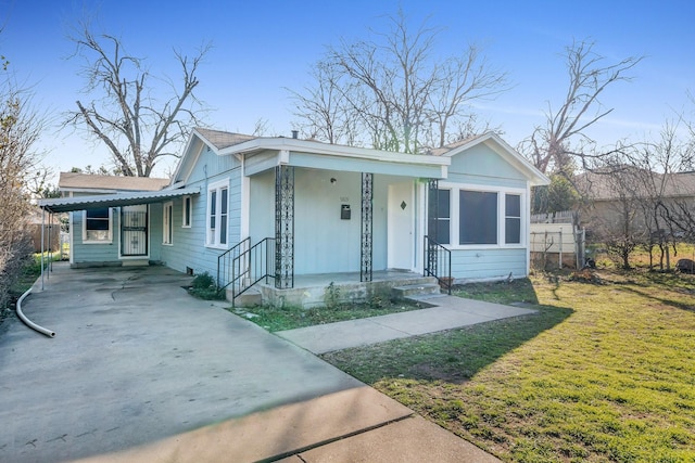 bungalow-style home with a front lawn