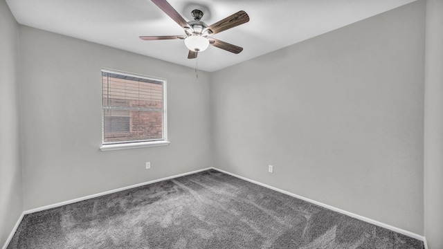 spare room with ceiling fan, carpet flooring, and baseboards