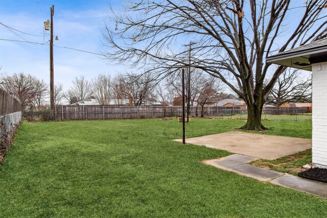 view of yard with a fenced backyard and a patio